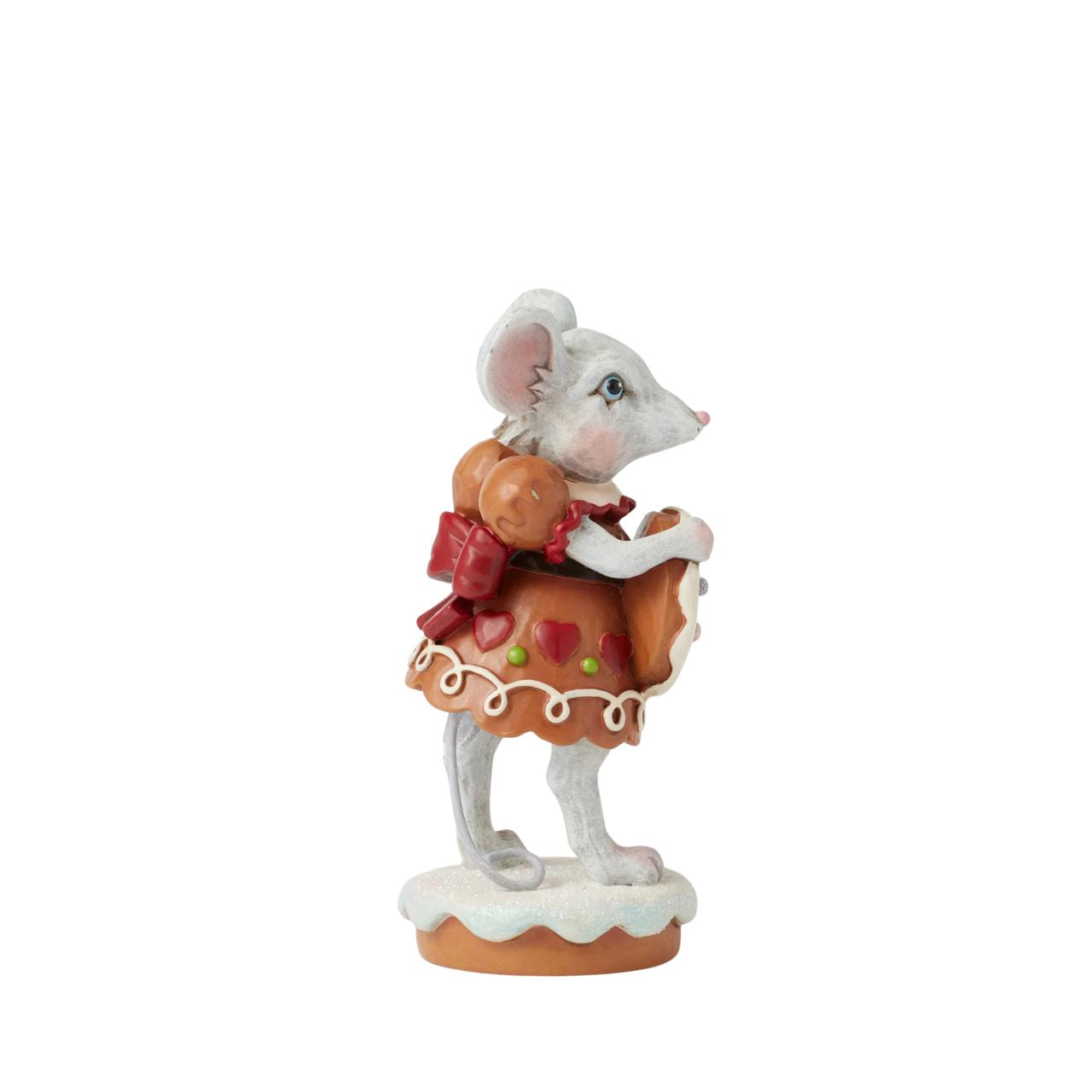 Wearing a festive gingerbread dress covered in intricate icing details, this sweet Gingerbread Christmas girl mouse by Jim Shore offers a sprinkled cookie with a warm smile.