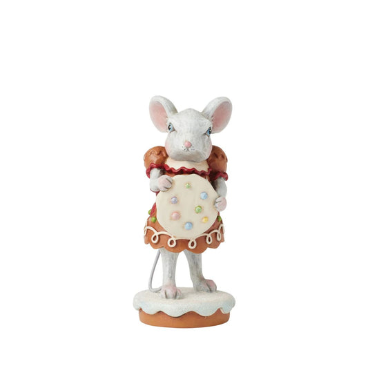 Wearing a festive gingerbread dress covered in intricate icing details, this sweet Gingerbread Christmas girl mouse by Jim Shore offers a sprinkled cookie with a warm smile.