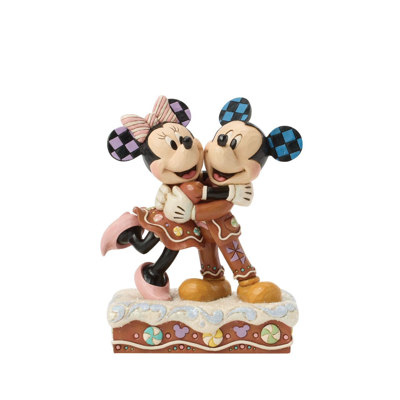 Sweet as sugar, Mickey and Minnie Mouse are decorated like gingerbread cookies in this charming Jim Shore holiday design. With peppermints and rosemaling accents, they look fresh from the oven and full of Christmas cheer as they embrace with love.