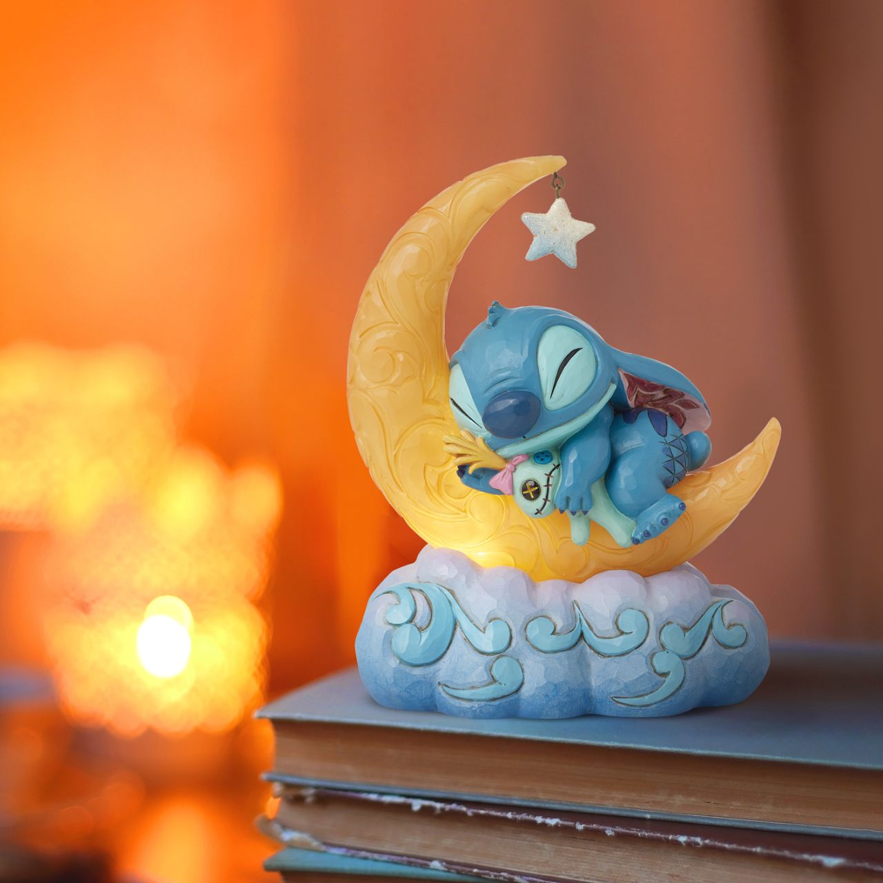 Snuggled up with his plush Scrump, Disney's Stitch is ready for dreamland. Asleep on a crescent moon that glows, this is the perfect addition to any display or bedroom. Requires 3x AAA batteries (not included), uses an automatic timer for 6 hours on, 18 hours off.