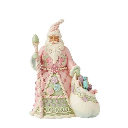 This adorable Heartwood Sweets Santa designed by Jim Shore is dressed in delightful pastel pinks and greens, adorned with whimsical sugar plum candies.