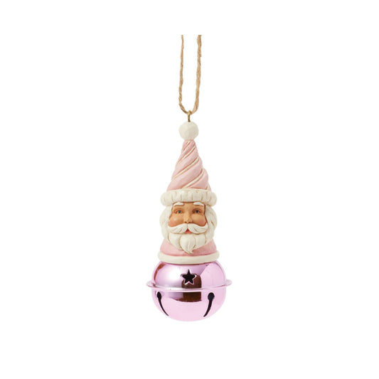 This delightful Jim Shore Heartwood Sweets jingle bell ornament features a charming miniature bust of Santa, complete with a pastel pink icing hat and rosy cheeks that exude holiday cheer. Ring in the season with Jim Shore.