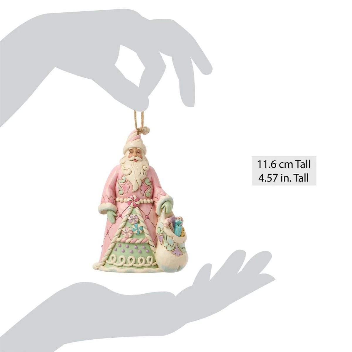 This cheerful Santa ornament carries a sack overflowing with colourful candy delights. Jim Shore's hand-painted details and rosemaling patterns give Santa a rich, festive charm. A sugary-sweet nod to childhood holiday dreams.