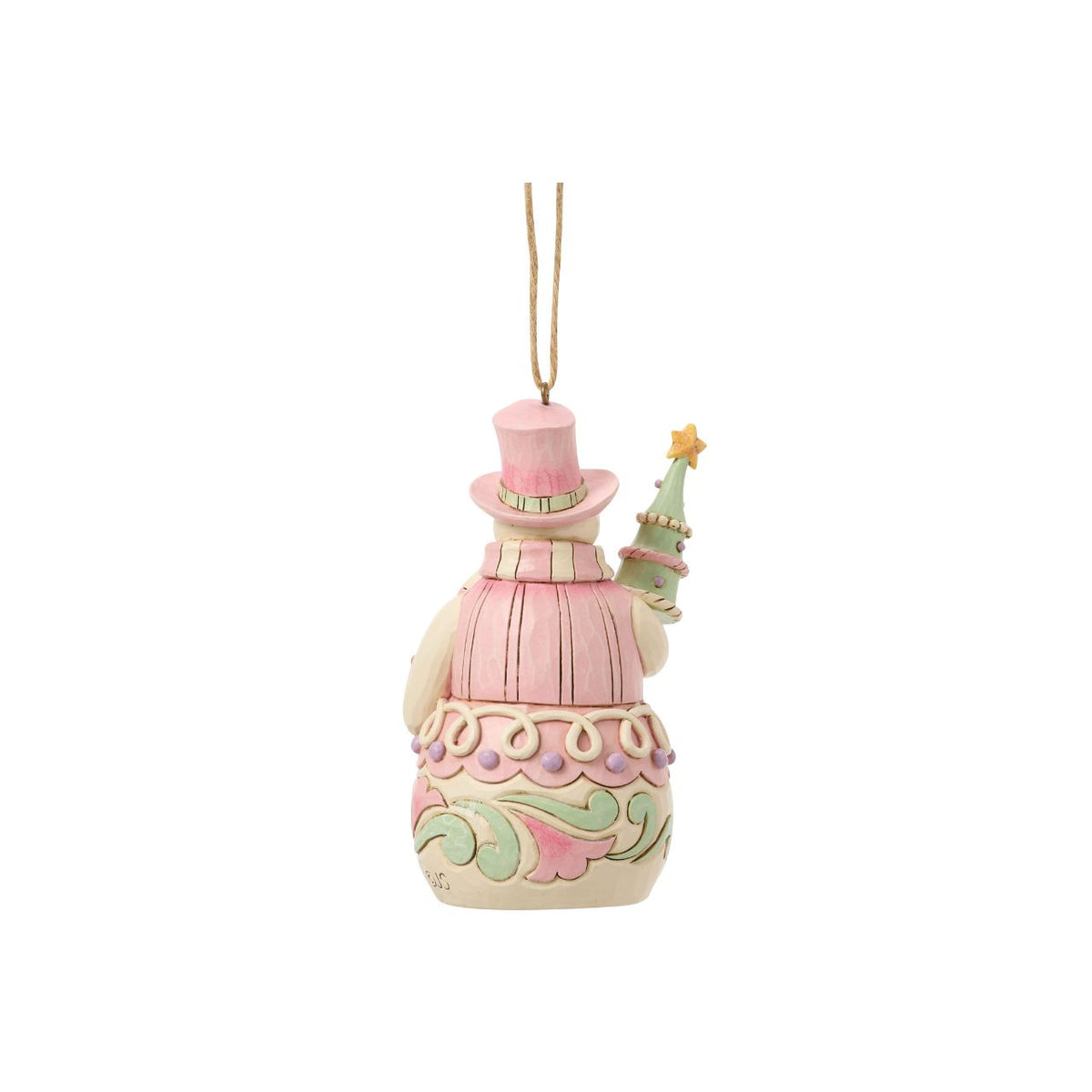 Bundled up for the season, this snowman ornament carries a decorated Christmas tree in his arms. Jim Shore's intricate designs swirl across his coat, adding heart-warming detail to this classic winter character. A joyful symbol of holiday sweetness.