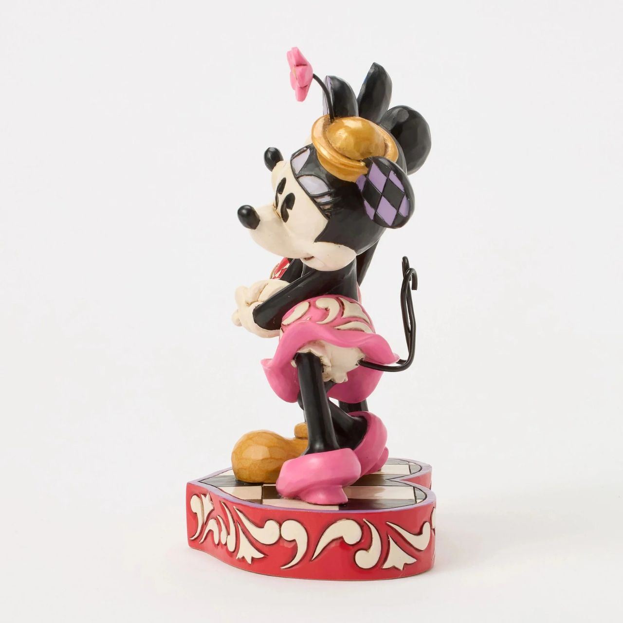 This romantic Disney design by Jim Shore features Mickey and Minnie Mouse, adorned with rosemaling and patchwork details. They stand on a heart-shaped base radiating the warmth of their timeless affection.