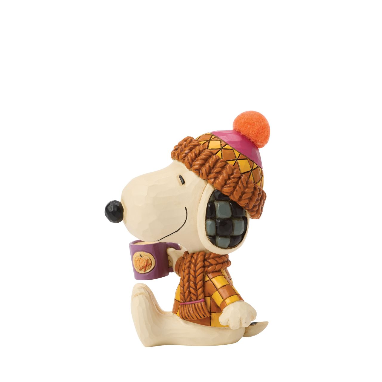Snoopy bundles up in cosy shades of orange in this charming Jim Shore design. Dressed for fall with a pompom hat and a mug in hand, he brings warmth and whimsy to autumn days with classic folk-art touches.