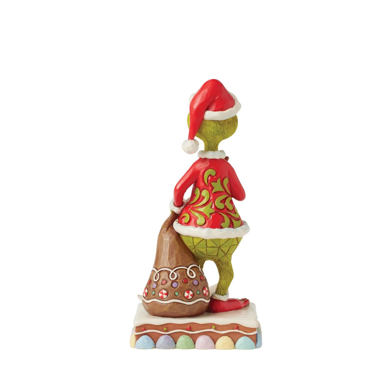 Dressed as Santa with a sack to steal presents, The Grinch gleefully munches on cookies and spills Santa's milk. Adorned with Jim Shore's signature rosemaling and intricate details, this piece brings The Grinch's playfully sinister spirit to life.