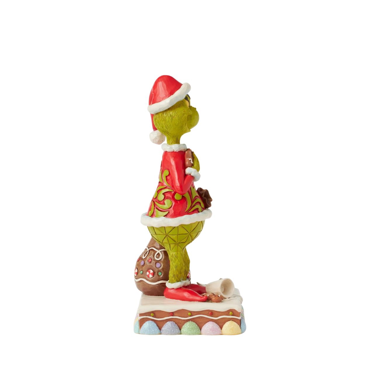 Dressed as Santa with a sack to steal presents, The Grinch gleefully munches on cookies and spills Santa's milk. Adorned with Jim Shore's signature rosemaling and intricate details, this piece brings The Grinch's playfully sinister spirit to life.