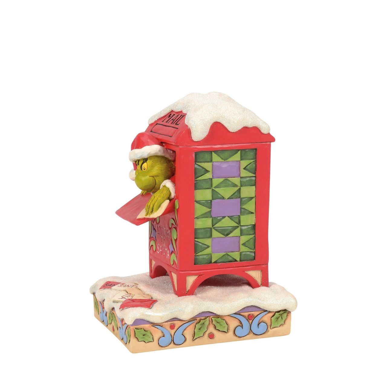 In a comical scene of holiday mischief, The Grinch hides inside a red mailbox, tearing up letters to Santa. Decorated with Jim Shore's signature rosemaling and patchwork, this piece captures The Grinch's sneaky spirit with a festive twist.