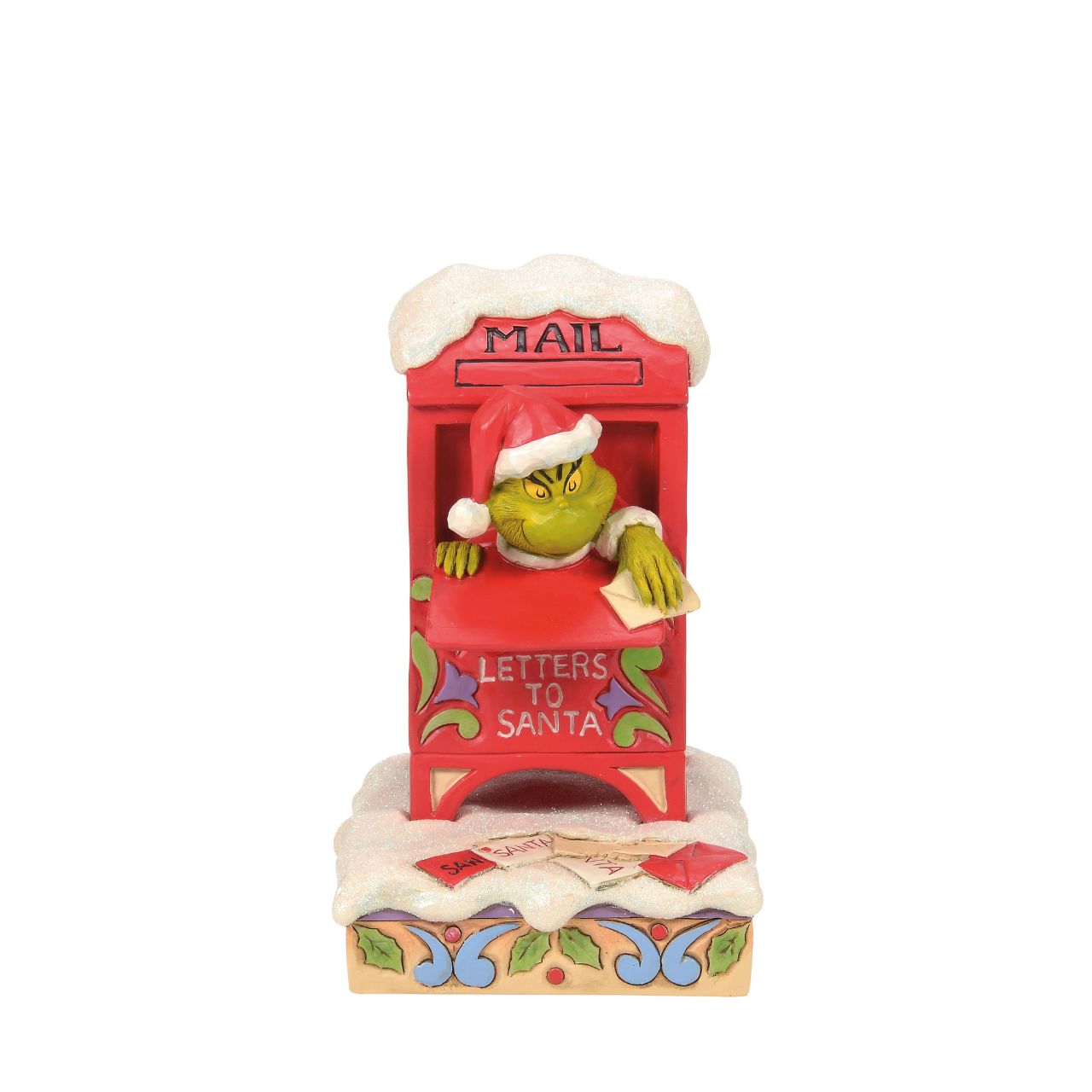 In a comical scene of holiday mischief, The Grinch hides inside a red mailbox, tearing up letters to Santa. Decorated with Jim Shore's signature rosemaling and patchwork, this piece captures The Grinch's sneaky spirit with a festive twist.