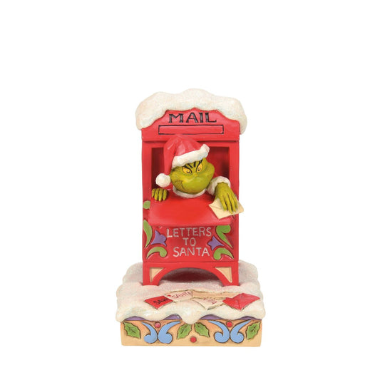 In a comical scene of holiday mischief, The Grinch hides inside a red mailbox, tearing up letters to Santa. Decorated with Jim Shore's signature rosemaling and patchwork, this piece captures The Grinch's sneaky spirit with a festive twist.