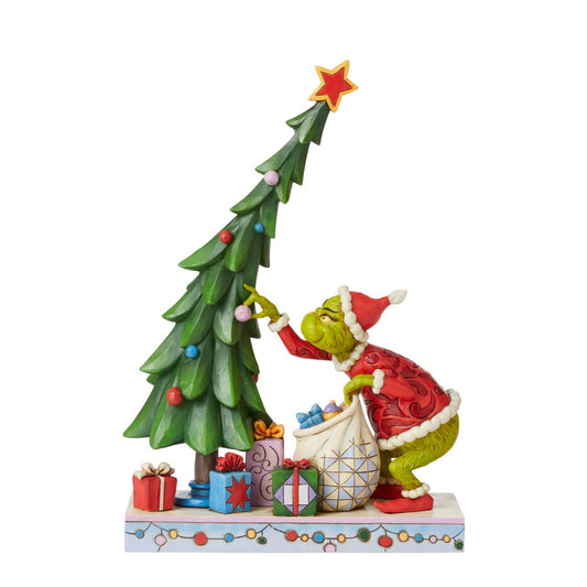 Grinch Undecorating Tree Figurine - The Grinch by Jim Shore  Award winning artist Jim Shore has created a piece that shows the iconic Grinch up to no good. The Grinch is mid-heist in this dazzling Jim Shore figurine. He deposits ornaments into his bag with that mischievous grin. Dressed as Santa, the Grinch takes gifts rather than gives them, but he'll surely bring your home some festivity.