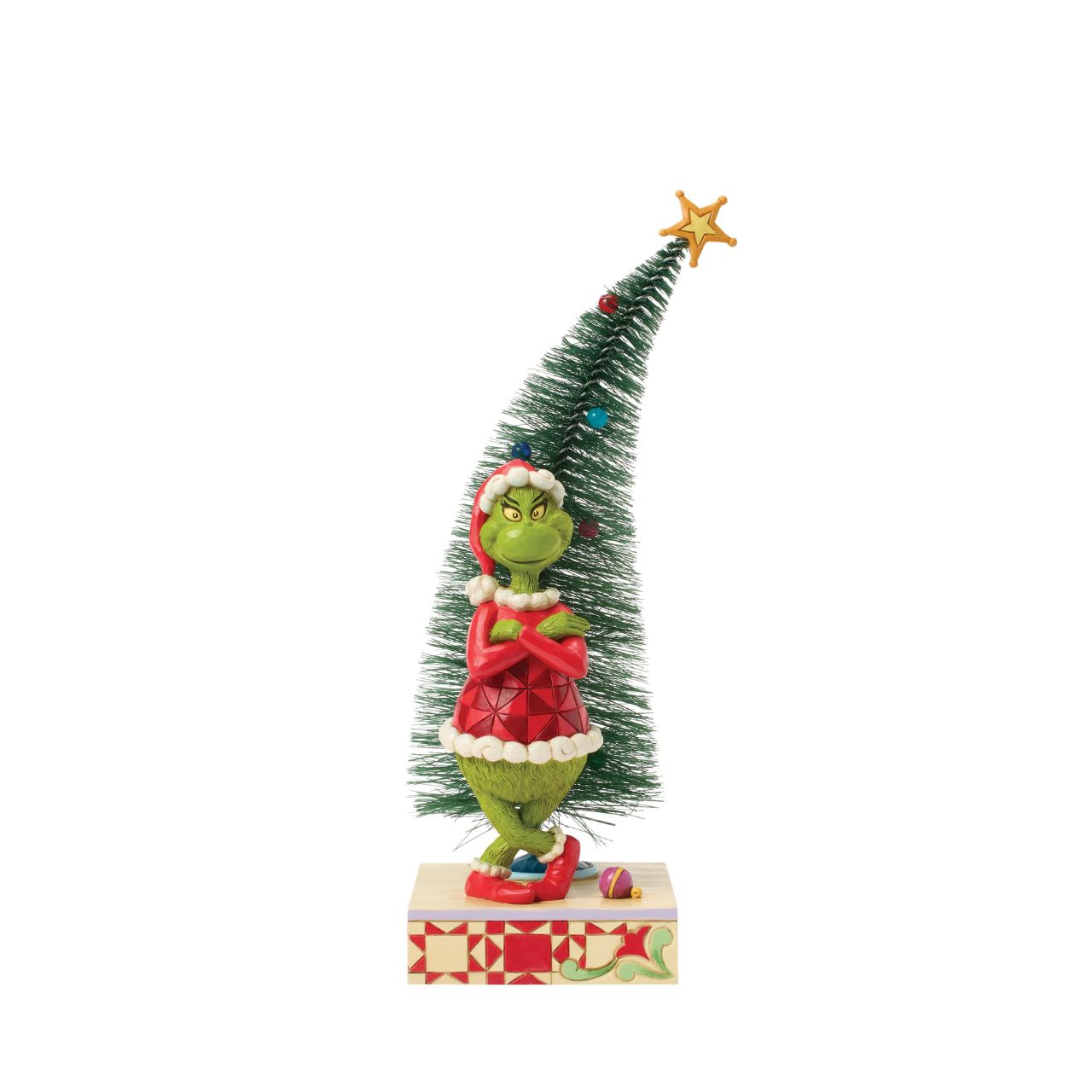 This playful Jim Shore design features The Grinch, arms crossed with a smirk, exuding snarky attitude as he stands beside a beautiful sisal tree with vibrant ball ornaments. Bring mischief home with Jim Shore's intricate detailing and rich colours.