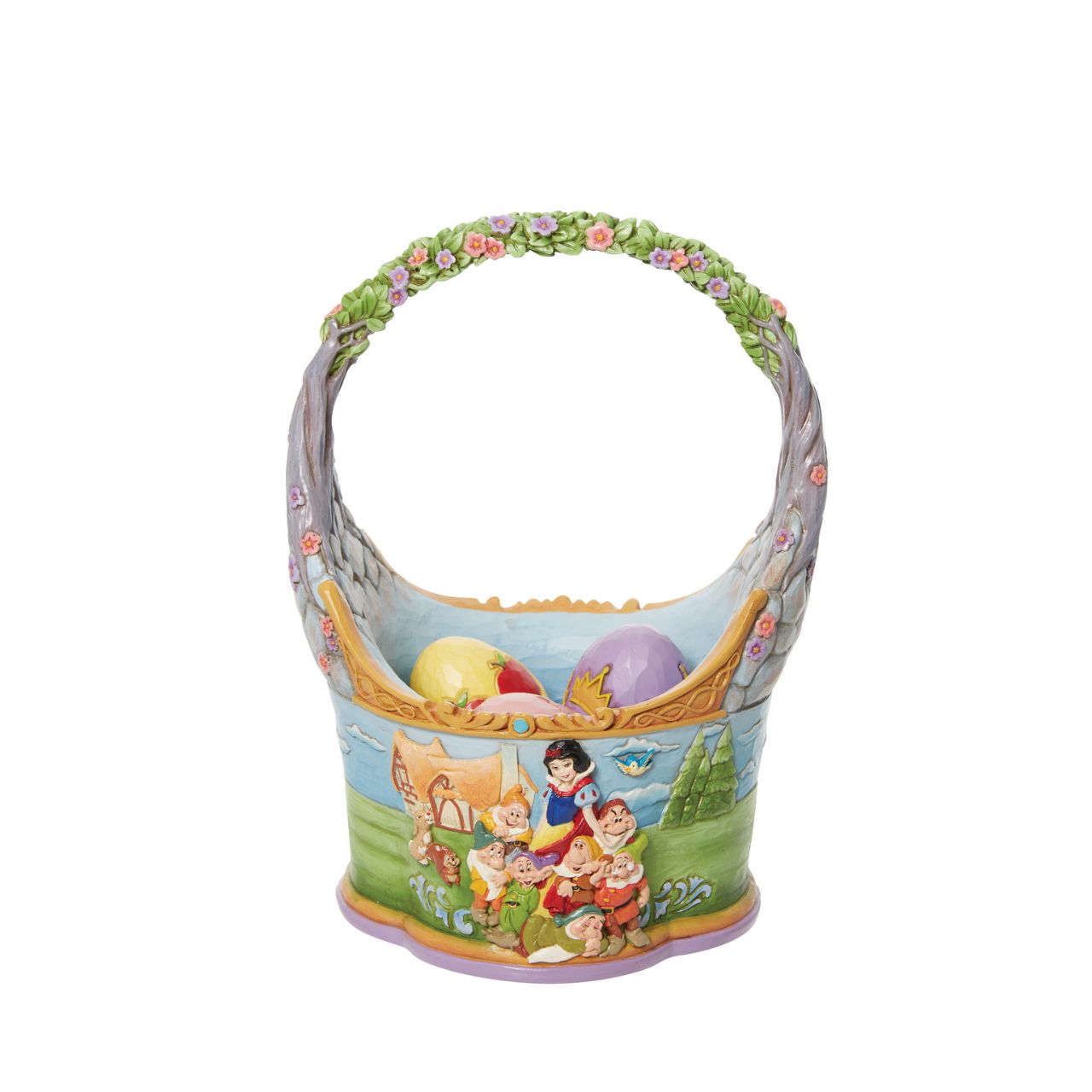 "The Tale That Started Them All " In honour of the 85th anniversary of Snow White and the Seven Dwarfs, Jim Shore crafts a dazzling Easter basket with 3 eggs showcasing the icons from the classic film in intricate detail and colour. The basket features two striking sides illustrating Snow White with her Prince and with her merry Seven Dwarfs.