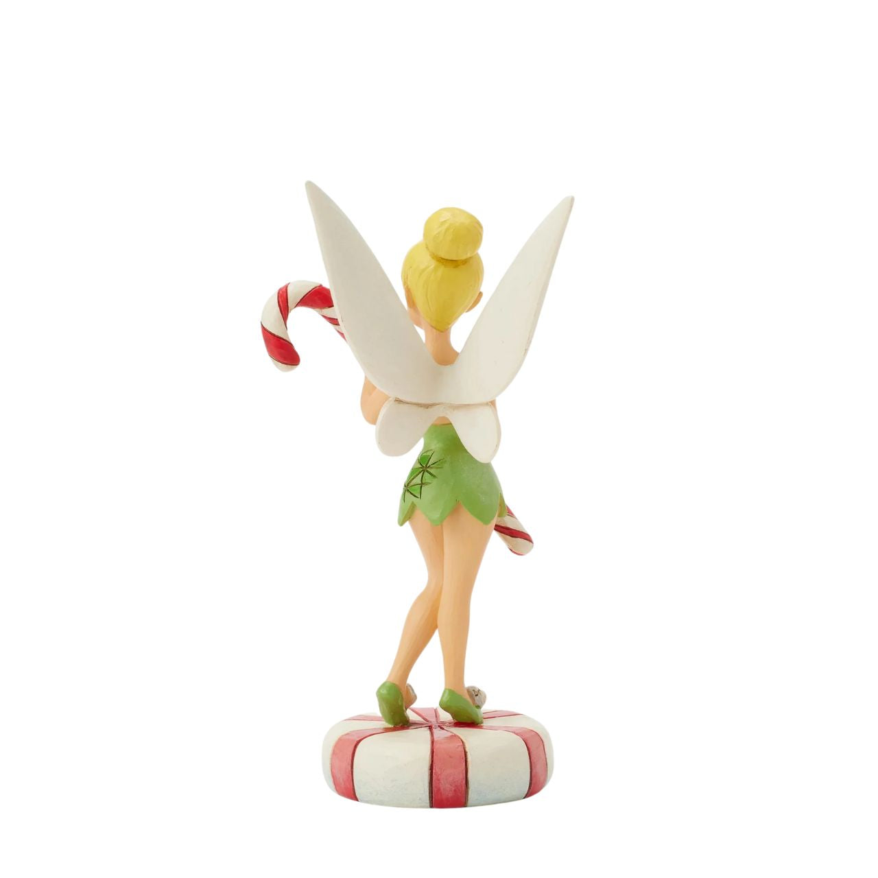 In this enchanting Jim Shore design, Tinker Bell stands atop a vibrant peppermint, delicately holding a candy cane with a sweet smile that radiates holiday warmth. Her enchanting presence brings a touch of pixie dust and magic to the holiday season.