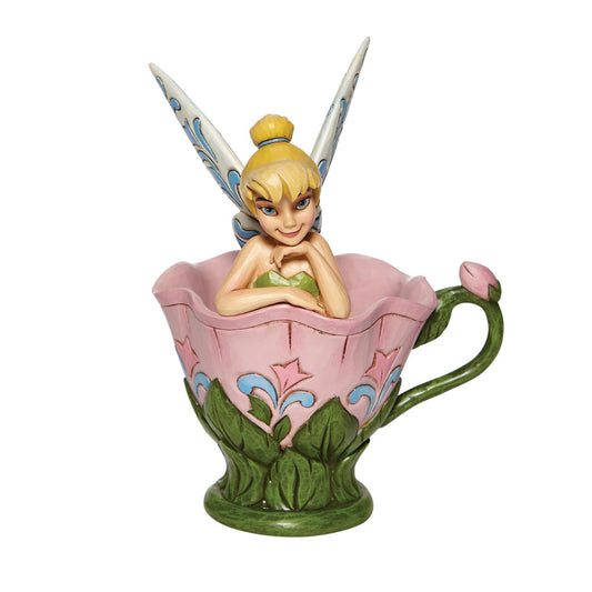 Disney Tinkerbell Sitting in a Flower Figurine A Spot of Tink by Jim Shore  All the way from Neverland, this sweet and sassy fairy, takes a flower break before she's off on her next adventure. This Disney by Jim Shore piece is intricately hand sculpted and is great for any Tinker Bell enthusiast. Made from cast stone.