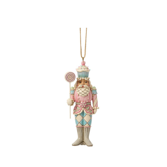 A playful twist on tradition, this toy soldier holds a bright candy lollipop and wears a cupcake helmet. Jim Shore's artistry transforms the disciplined officer into a whimsical holiday friend. Perfect for sweetening any Christmas display.