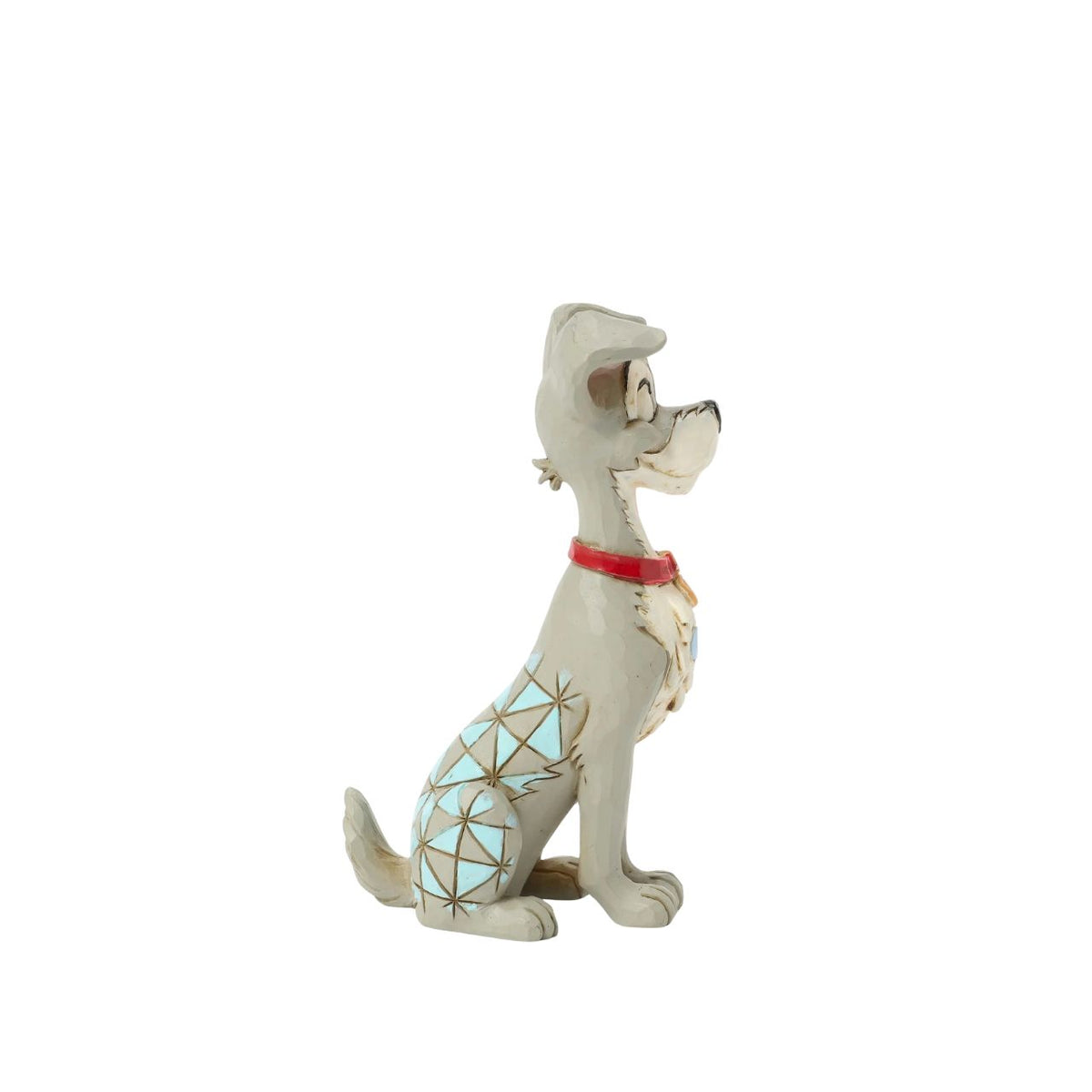 Celebrate the 70th anniversary of Lady and the Tramp with this dashing Jim Shore rendition of the Tramp. Adorned with the artist's signature patchwork and rosemaling details, he sits astutely in his new collar, ready to embrace his life with Lady.