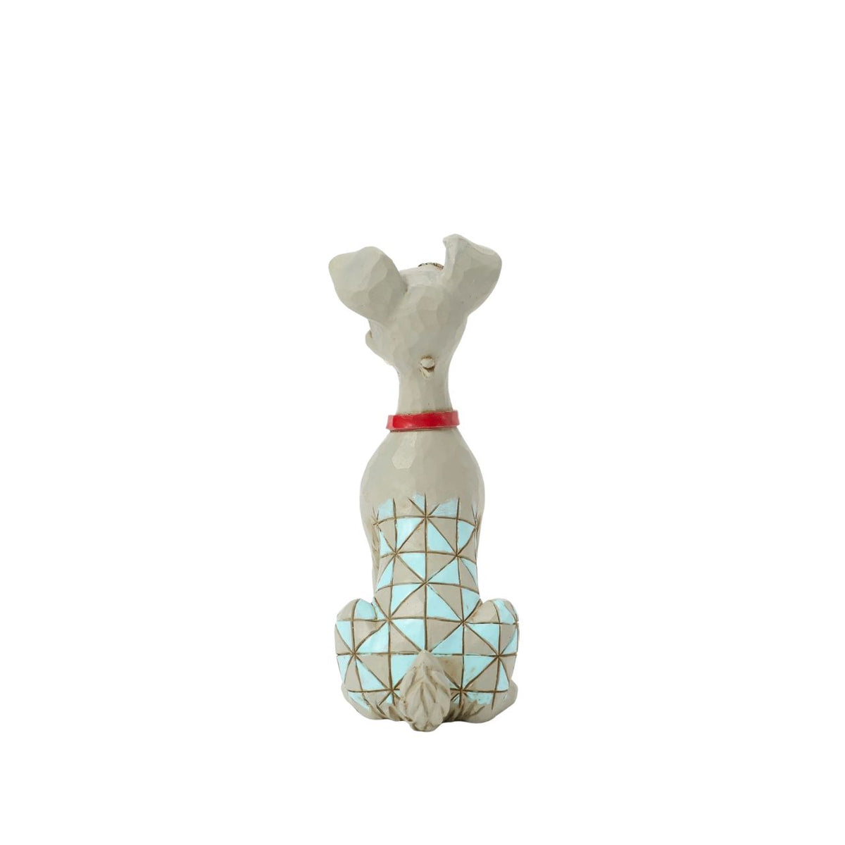 Celebrate the 70th anniversary of Lady and the Tramp with this dashing Jim Shore rendition of the Tramp. Adorned with the artist's signature patchwork and rosemaling details, he sits astutely in his new collar, ready to embrace his life with Lady.