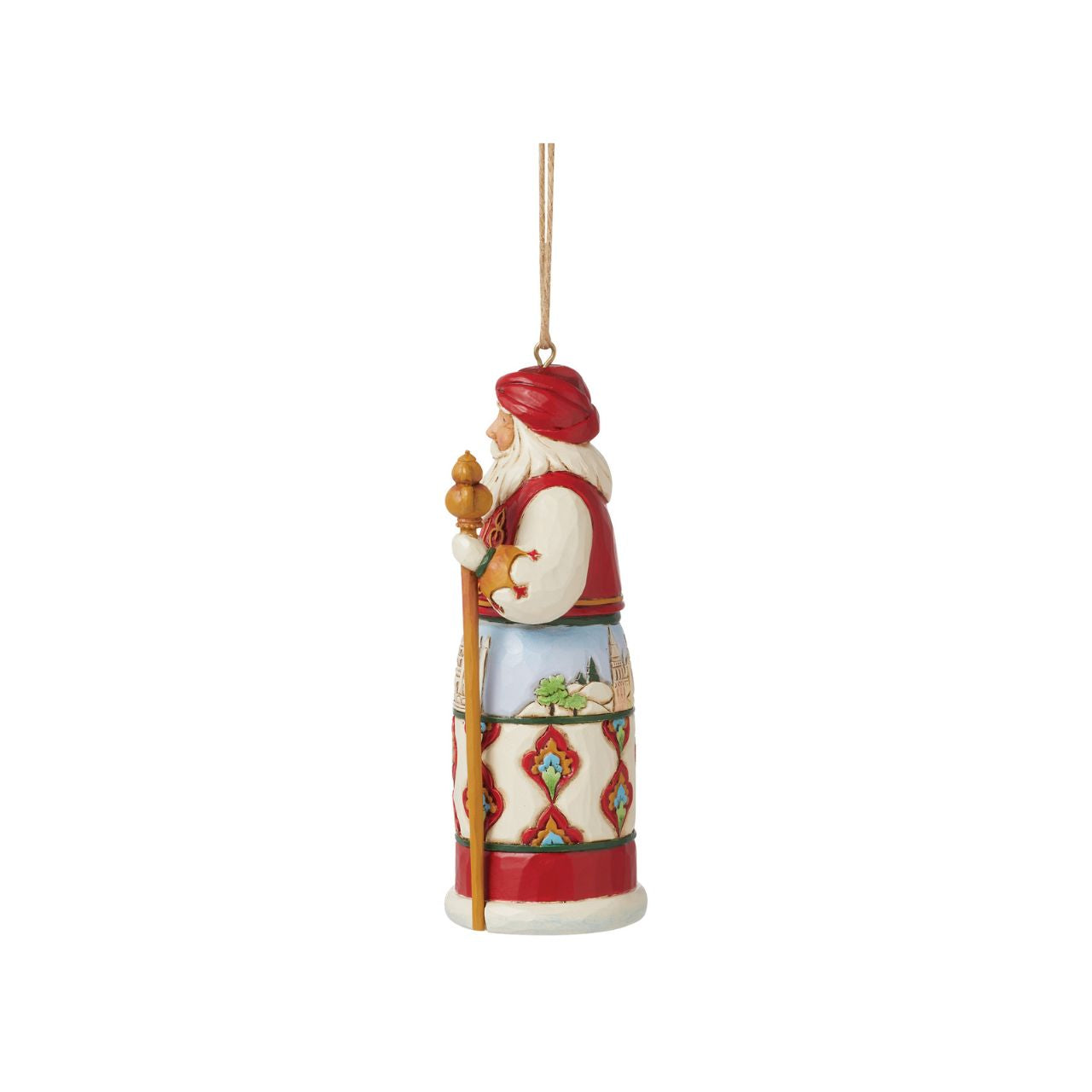 Jim Shore's Christmas Around the World collection celebrates tradition and culture. Incorporating each country's unique customs, this Turkish Santa ornament wears traditional robes with famous architecture, a red turban, and ornate designs.