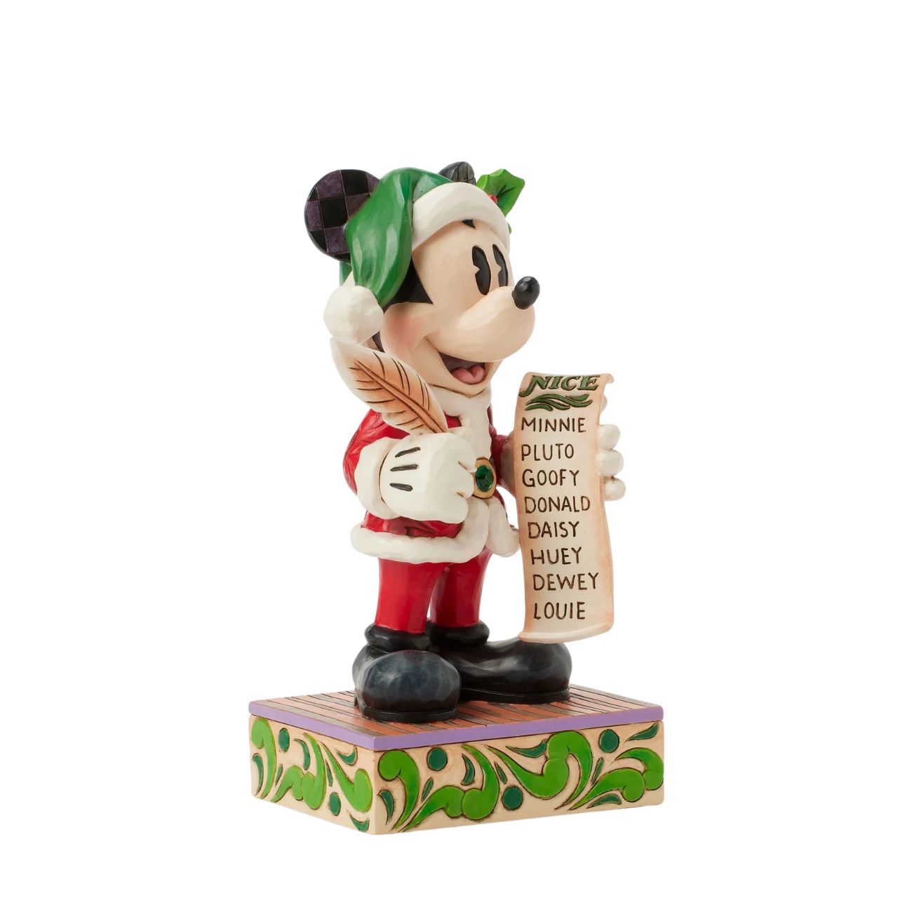 In this enchanting Jim Shore Christmas scene, Mickey Mouse dons a striking red rosemaling suit accented with a green jewelled belt and a Santa hat trimmed with holly. He holds a quill and a list of Naughty and Nice Disney characters with a smile.