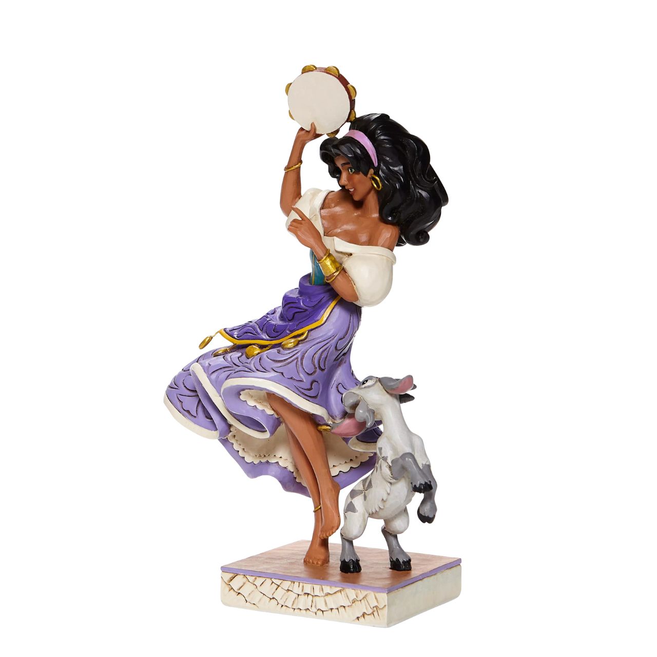 Disney Traditions Esmeralda & Djali  from The Hunchback of Notre Dame  Loyal goat Djali assists his kind-hearted gypsy owner, Esmeralda, as she performs in Disney's classic, Hunch Back of Notre Dame, in this designed by Jim Shore sculpt.