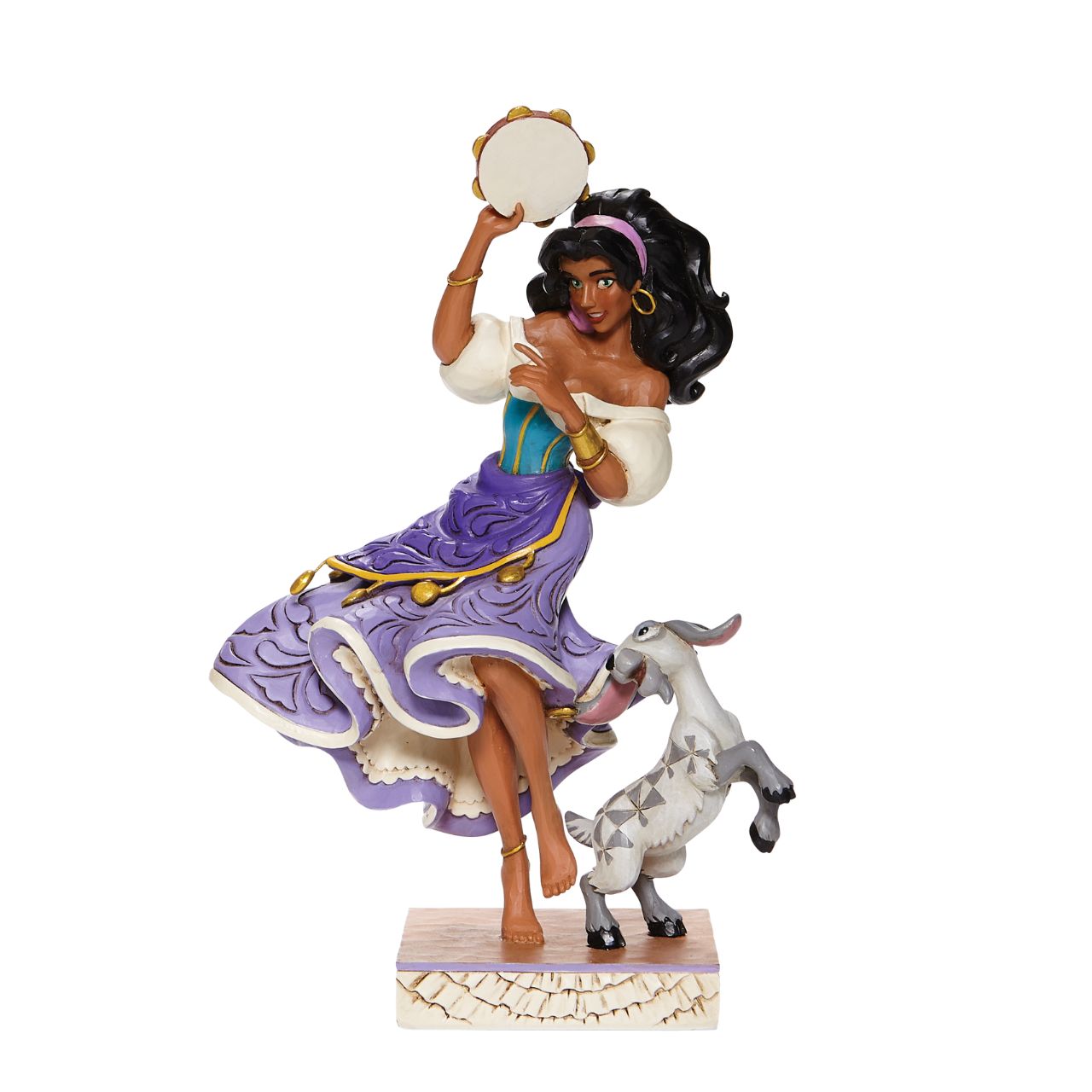 Disney Traditions Esmeralda & Djali  from The Hunchback of Notre Dame  Loyal goat Djali assists his kind-hearted gypsy owner, Esmeralda, as she performs in Disney's classic, Hunch Back of Notre Dame, in this designed by Jim Shore sculpt.