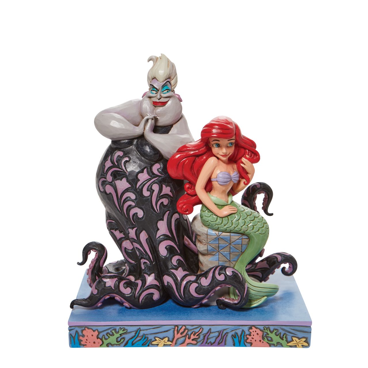 This Jim Shore piece ventures under the sea to share a scene of good and evil. Smiling innocently, Ariel, the little mermaid, sits on a stump as the sea witch, Ursula, connives cruelly behind her shoulder. Packaged in a branded gift box.