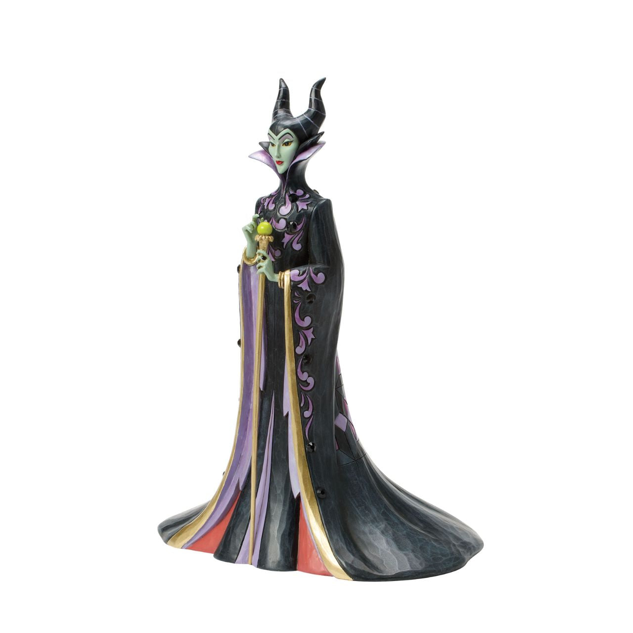 This Jim Shore design captures the vengeful villainess, Maleficent, in her striking black and purple cloak adorned with Shore's quilt and rosemaling patterns. With a sinister gaze, she taps her staff, channeling dark magic with malice in her heart.