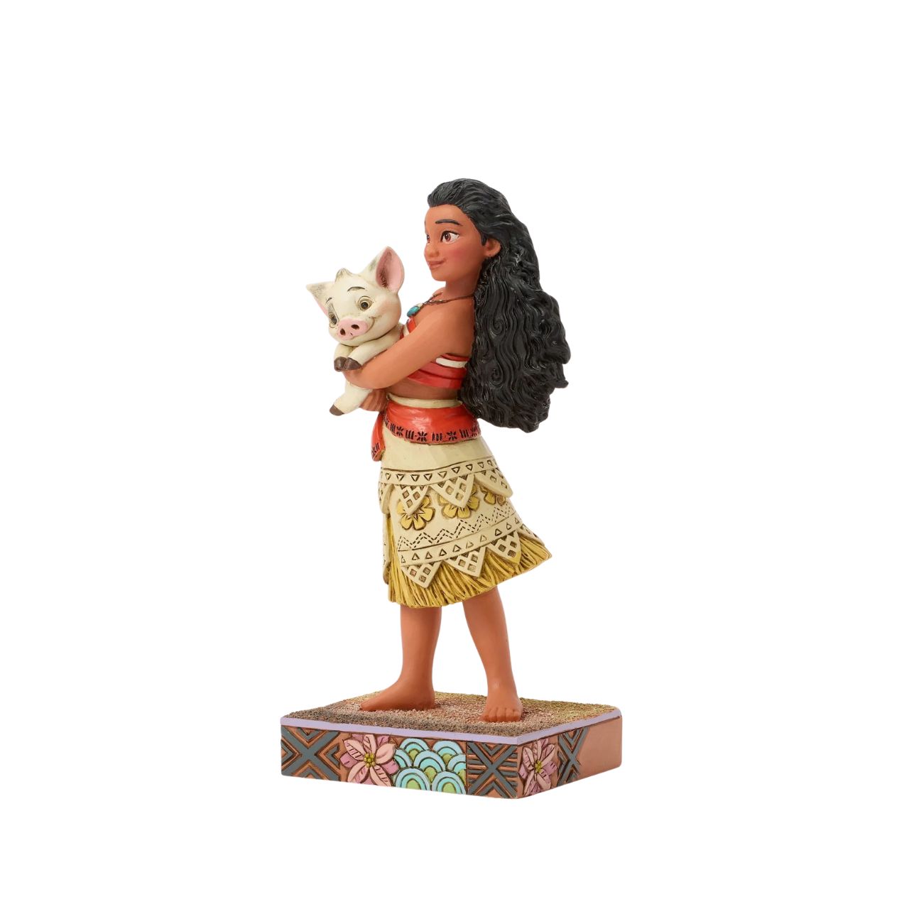This intricate Jim Shore scene depicts Moana holding her best friend, Pua the pig, in a tight embrace. They smile together on a sand stage, with textured patterns and vibrant colour. Jim Shore's warm craftsmanship brings the scene to life.