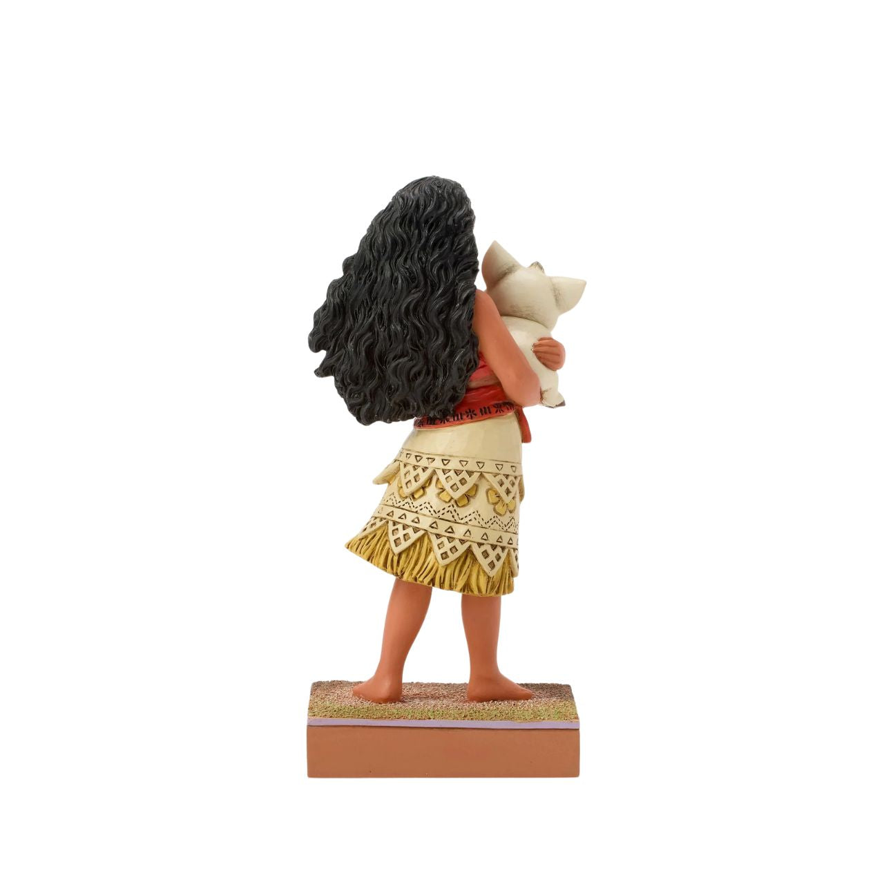 This intricate Jim Shore scene depicts Moana holding her best friend, Pua the pig, in a tight embrace. They smile together on a sand stage, with textured patterns and vibrant colour. Jim Shore's warm craftsmanship brings the scene to life.