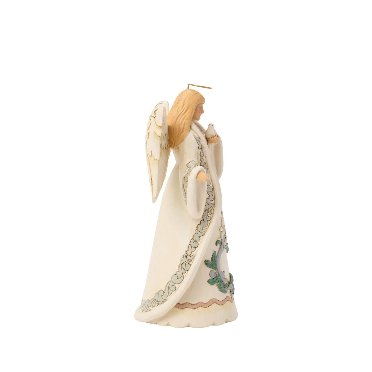 The Heartwood Creek Woodland Angel with Dove figurine is a beautiful testament to Jim Shore's artistry. This enchanting piece captures the essence of peace and goodwill, featuring an angel adorned with woodland patterns, gently holding a dove, a symbol of hope and tranquillity.