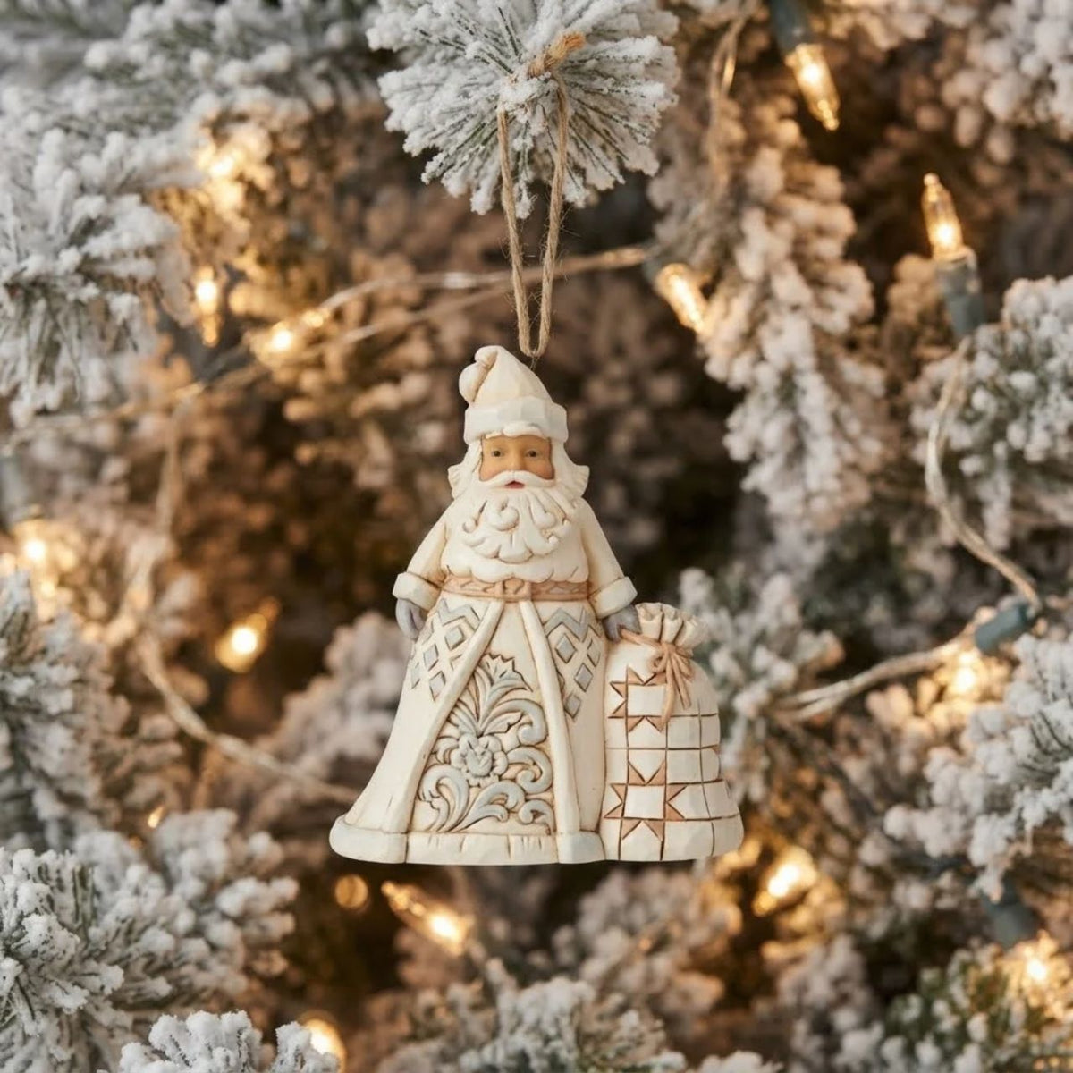 In muted colours, this cool hued Santa brings grandeur with his deliveries. With a bag heavy with presents, this Christmas hero smiles happily from your tree, admiring the nice boys and girls as they open presents in your home.