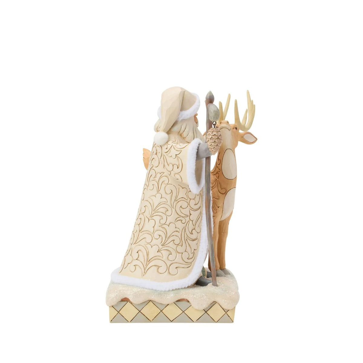 Celebrate the magic of Christmas with the Woodland Santa with Buck figurine from the Heartwood Creek collection by Jim Shore. This delightful figurine portrays Santa Claus in a heartwarming scene with a majestic buck, embodying the serene beauty of a winter forest.