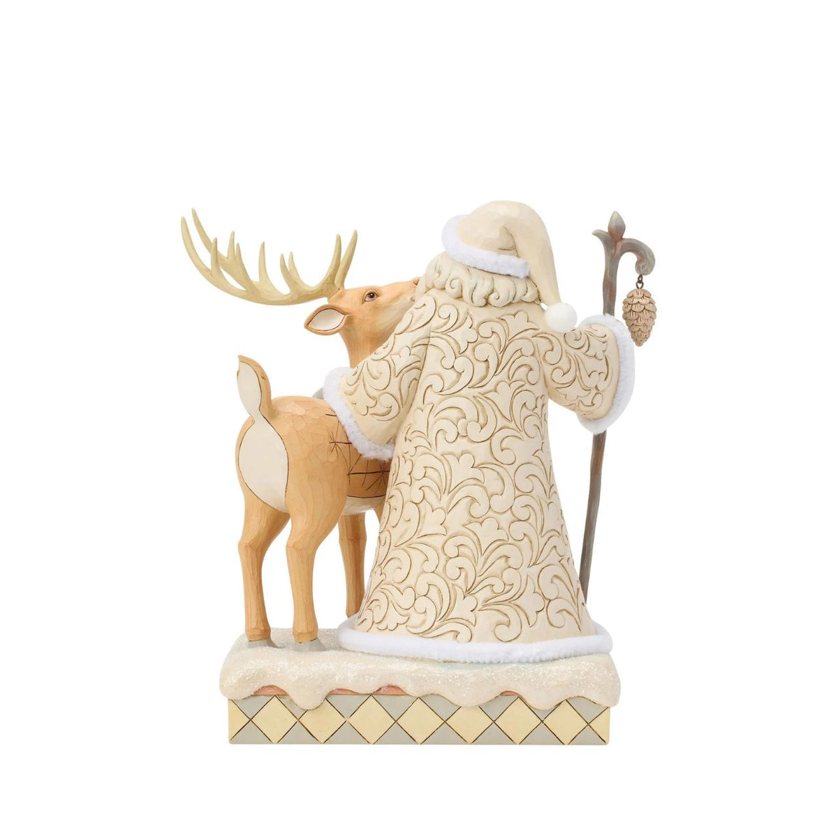 Celebrate the magic of Christmas with the Woodland Santa with Buck figurine from the Heartwood Creek collection by Jim Shore. This delightful figurine portrays Santa Claus in a heartwarming scene with a majestic buck, embodying the serene beauty of a winter forest.
