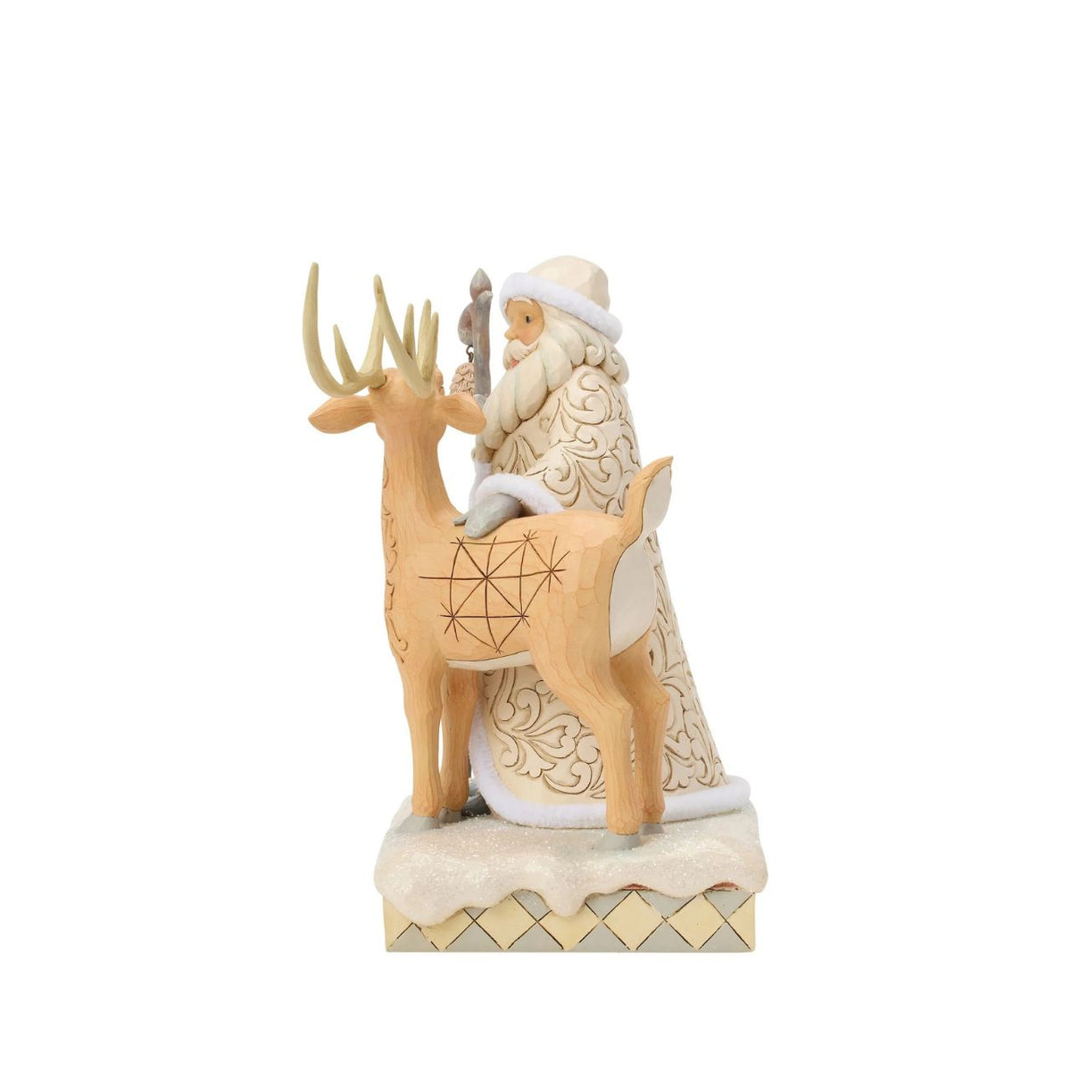 Celebrate the magic of Christmas with the Woodland Santa with Buck figurine from the Heartwood Creek collection by Jim Shore. This delightful figurine portrays Santa Claus in a heartwarming scene with a majestic buck, embodying the serene beauty of a winter forest.
