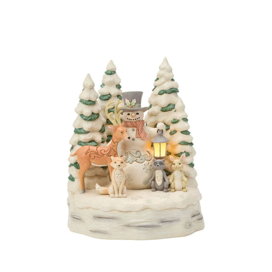 Embrace the peaceful beauty of winter with this enchanting LED snowman from Jim Shore's White Woodland collection.