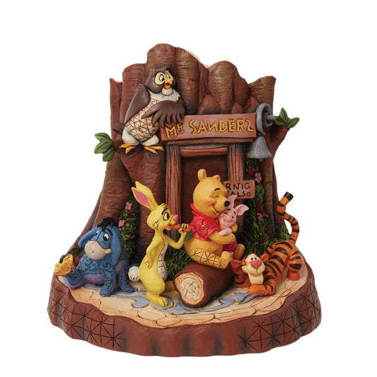 Disney Traditions Winnie The Pooh Carved by Heart  This stunning Winnie the Pooh statuette showcases the Hundred Acre Wood crew in stunning detail. Pooh, Piglet, Rabbit, Tigger, Owl, and Eeyore gather outside Pooh's house. Covered in astonishing patchwork detail, the piece is unmistakably Jim Shore.