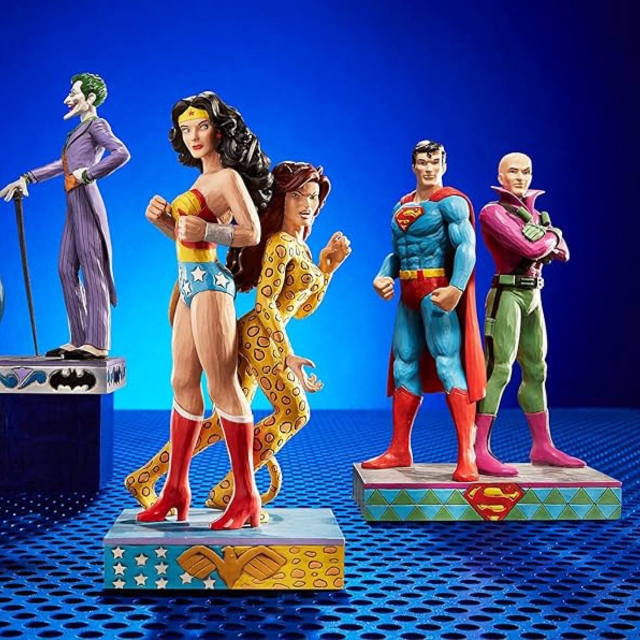 Jim Shore Wonder Woman and Cheetah Figurine  Jim Shore celebrates Wonder Woman and Cheetah back to back in his signature wood carved look and folk art styling. Sure to be a treasured gift across the generations. Unique variations should be expected as this product is hand painted.