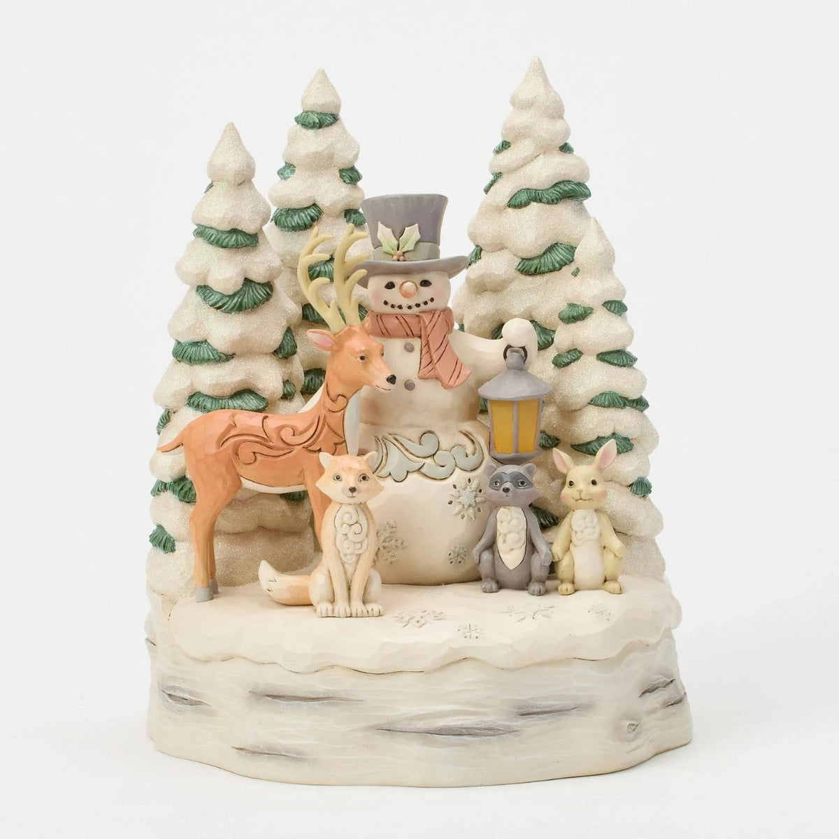 Embrace the peaceful beauty of winter with this enchanting LED snowman from Jim Shore's White Woodland collection.