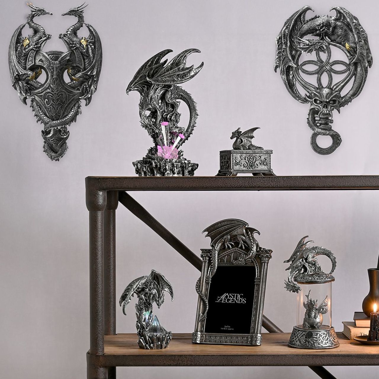 This silver coloured item with green crystals, is made from high-quality resin allowing for intricate detailing. A brand for customers and avid collectors who are drawn to the mystical and gothic aesthetic.