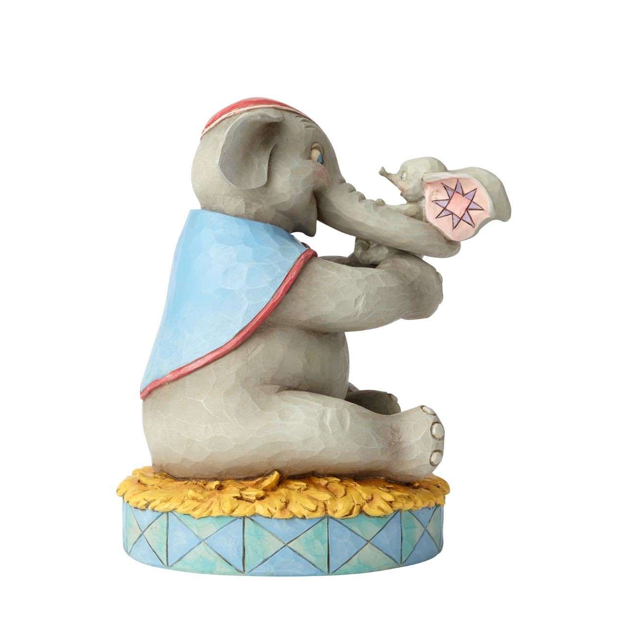 Disney Mrs Jumbo and Dumbo Figurine A Mother's Unconditional Love by Jim Shore  Fiercely protective and unconditionally loving, Mrs. Jumbo cherishes her big-eared baby Dumbo. Handcrafted and hand-painted in exquisite detail, this cast stone figurine by Jim Shore makes a beautiful keepsake for Mother's Day or as a new mum gift.