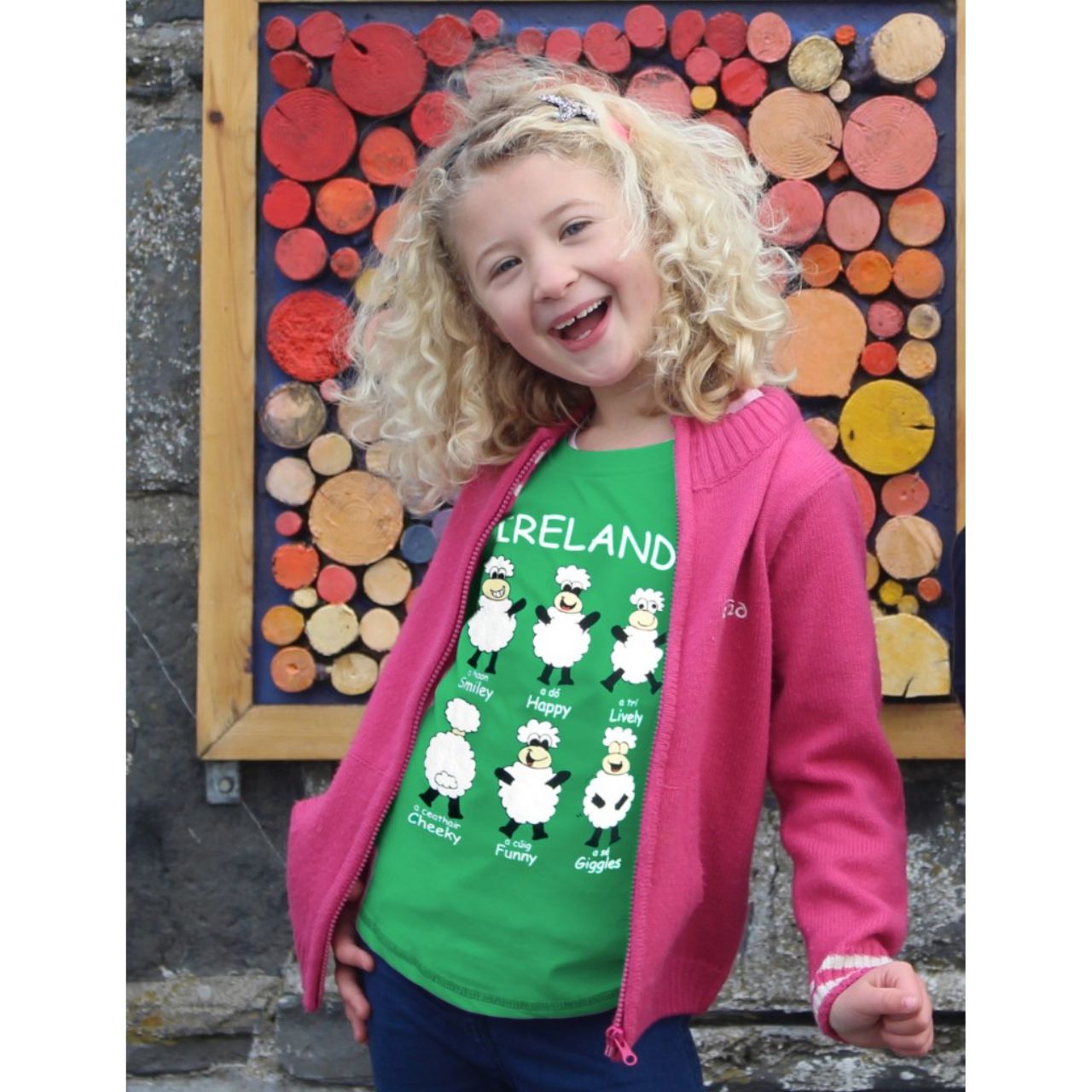 This emerald green cotton kids T-shirt is a part of the Traditional Craft Official Collection. It is a relaxed fit and features various different printed "Happy Sheep".