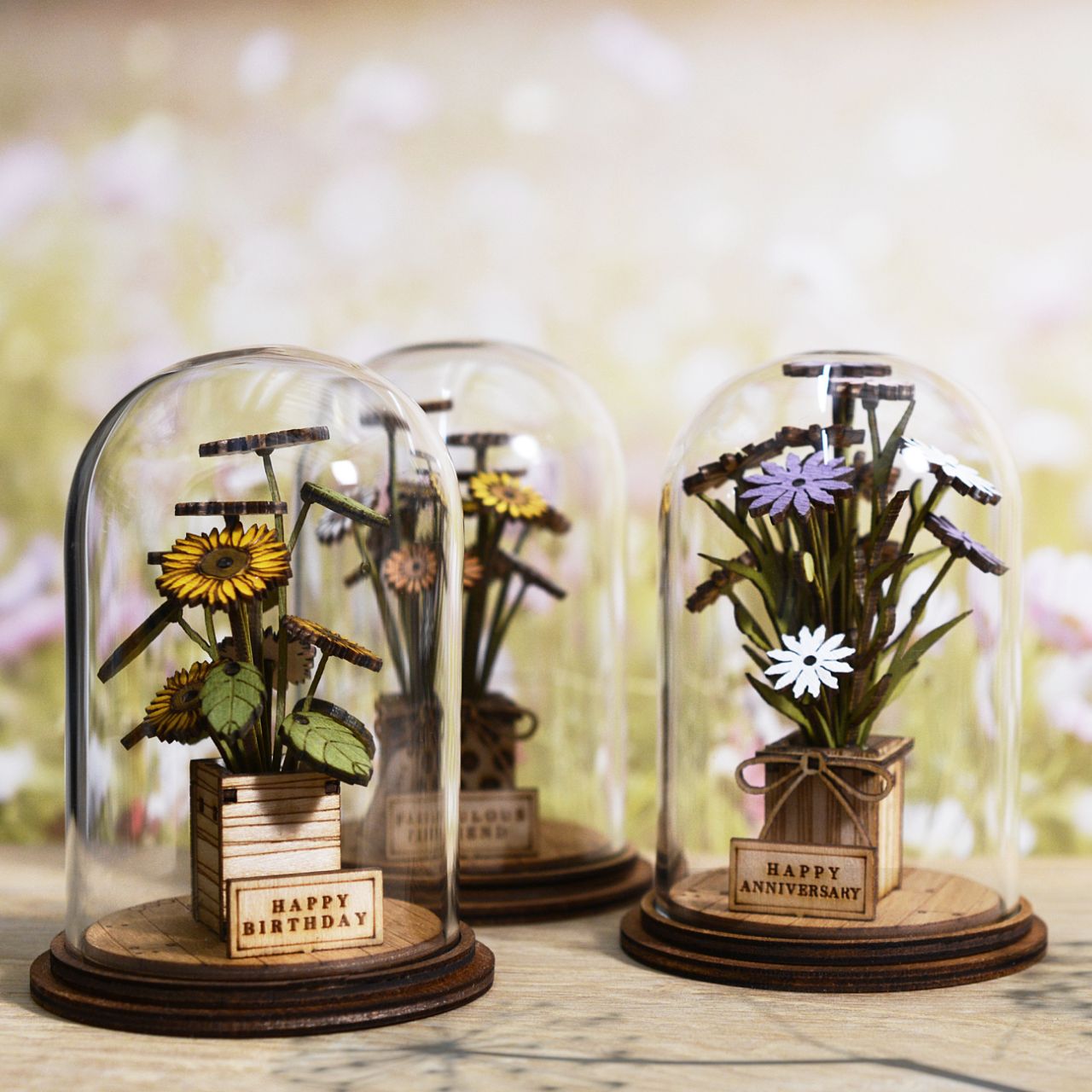 Celebrate an anniversary with this beautiful floral gift. This eco-friendly glass dome decoration encases a bunch of stunning purple and white flowers, adorned with a Happy Anniversary plaque. 