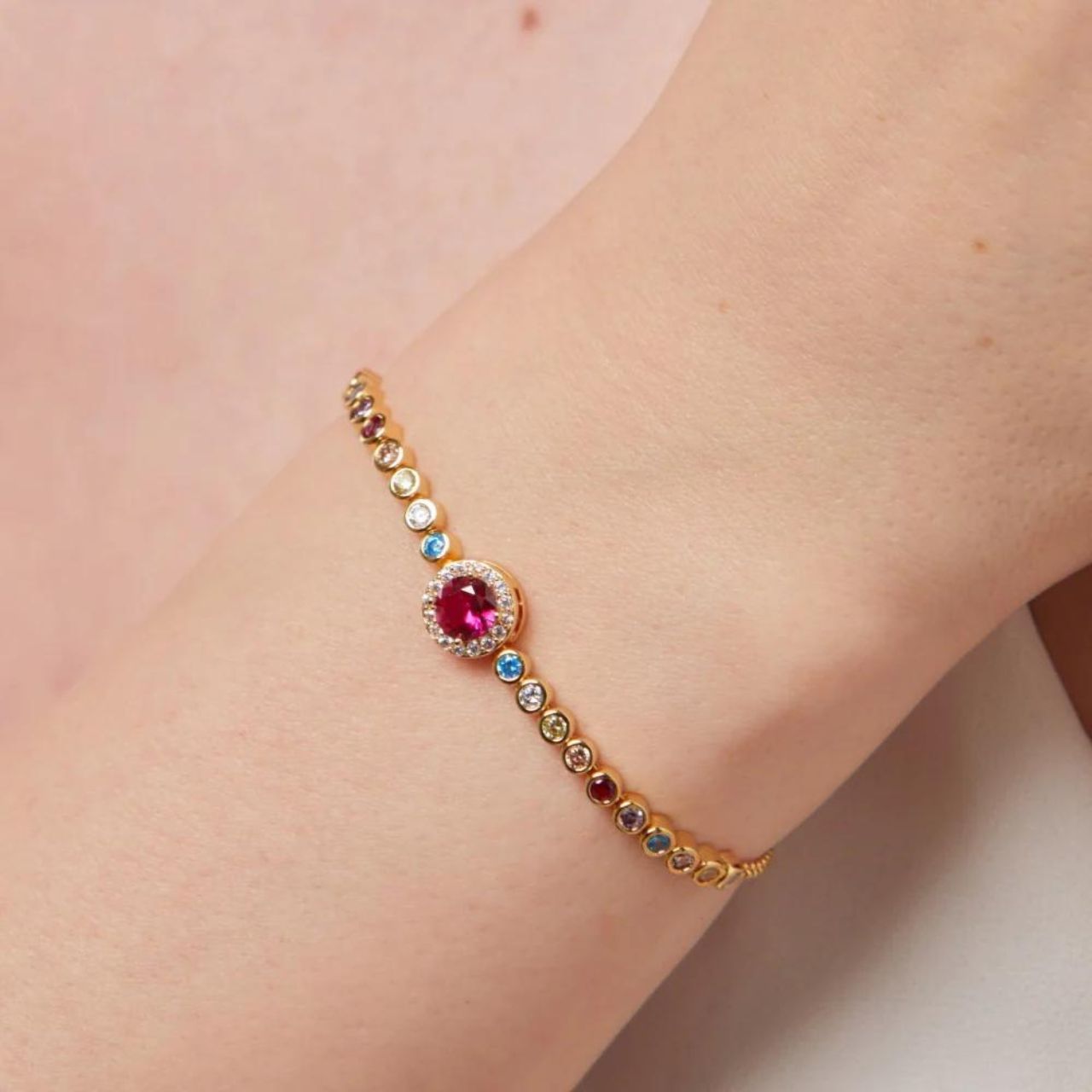Classic Multi Colour Bracelet by Knight & Day  Classic style bracelet embellished with multi colour CZ stones. Slider fastening. Gold plating.