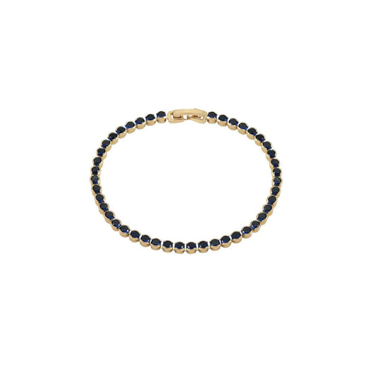 Miniature gold plated tennis bracelet with sapphire CZ stones. Elegant when worn alone and also ideal for layering with watch or other bracelets. Fold over clip fastening.