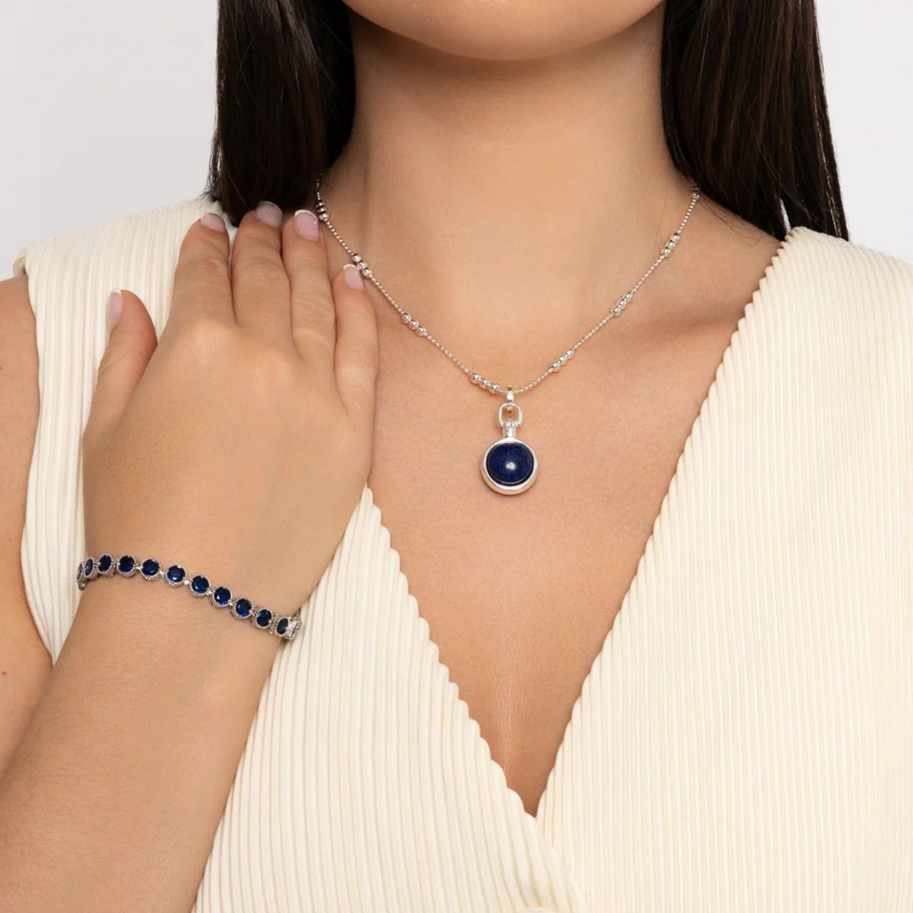 Beautiful rhodium plated tennis bracelet with Sapphire CZ stones. Fold over clasp fastening.