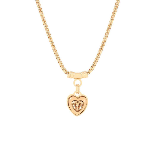 Elegant necklace with chunky heart drop embellished with golden shadow crystal.