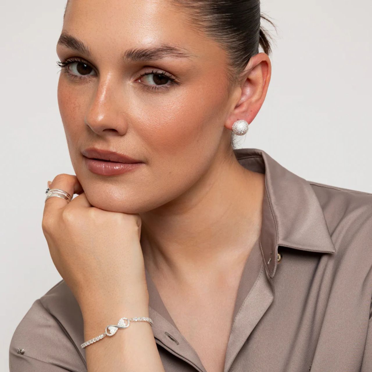 Beautiful silver plated bracelet with slider fastening & Infinity centre piece.