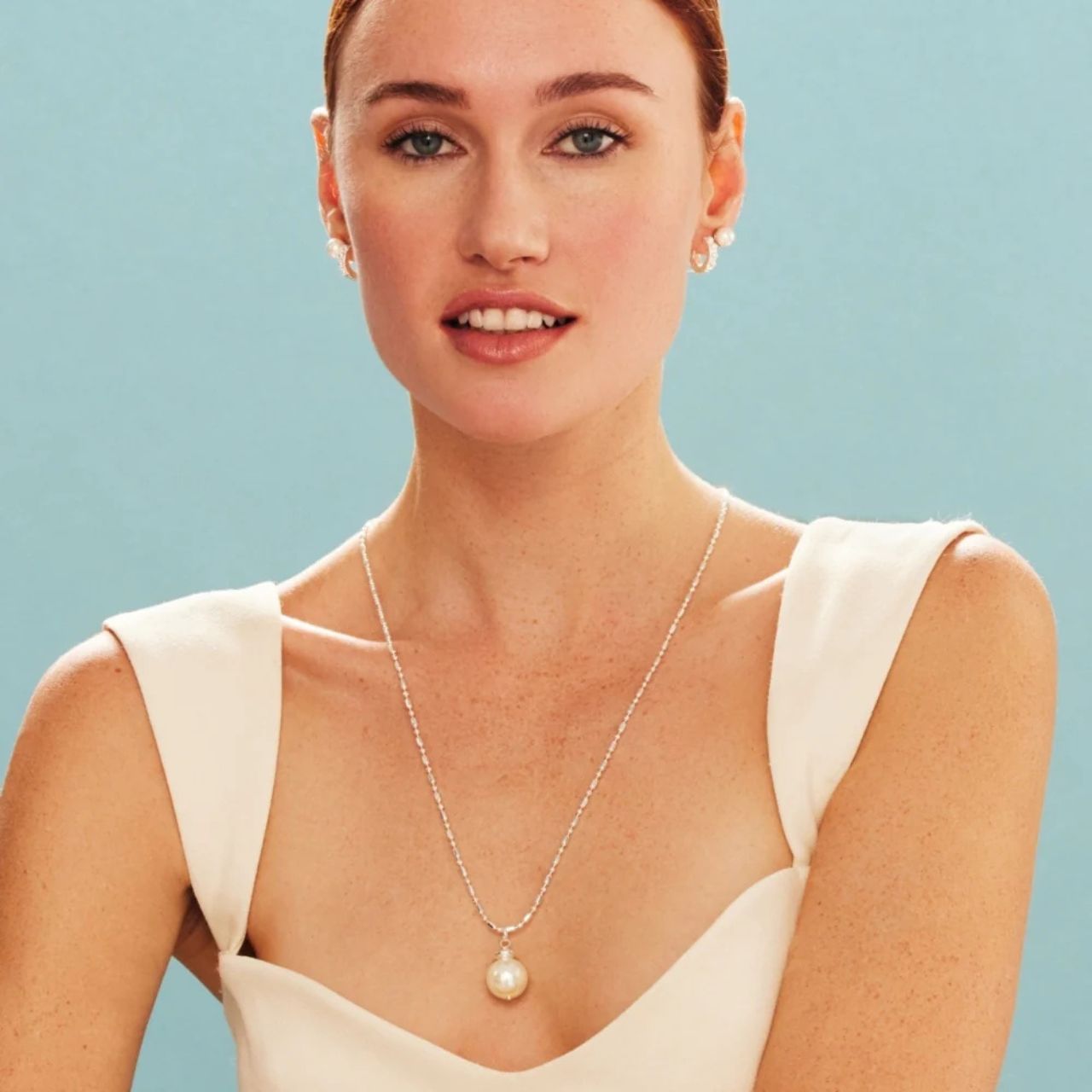 8mm pearl studs with AB white shell pearls.